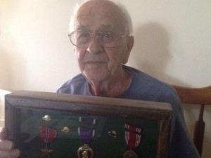 Anthony Cacace, 94, with medals from World War II.