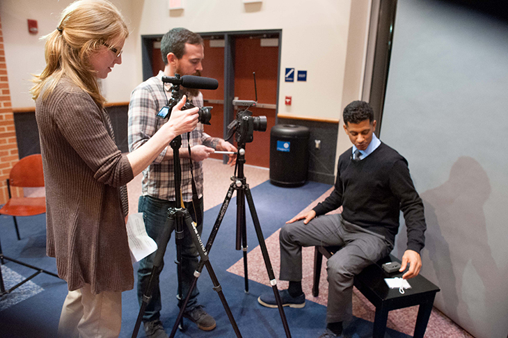 Assistant Professor Jodie Gil, left, University Assistant Jon Sackett, center, interview Jason Newton at SCSU Alumni Night. | Vern Williams Photo