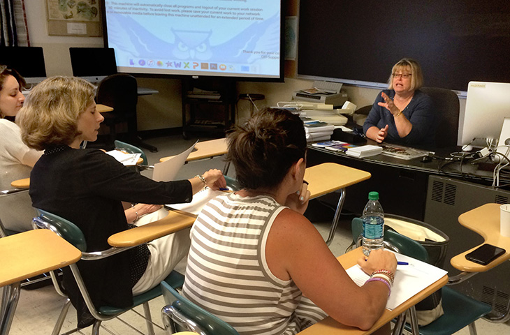 Cindy Simoneau, Journalism department chair, leads high school teachers during a workshop in June. | Vern Williams photo.