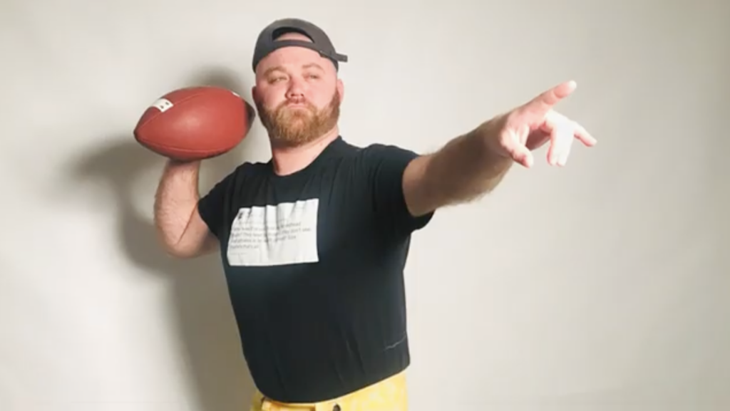 photo of Pete Paguaga holding football and pointing