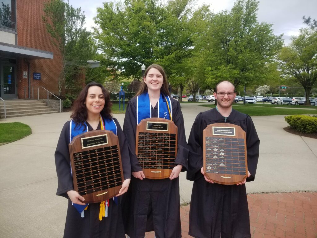 Mercado, Epstein and Paquette pose with the plaques that now include their names.